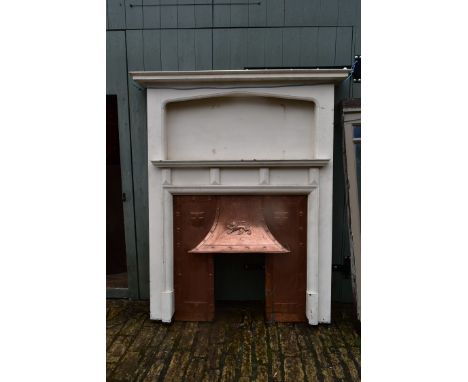 A painted vintage fire surround with hammered and embossed copper hood and insert. H.190xW.140cm 