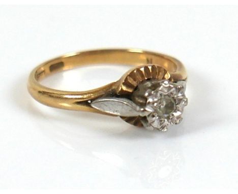 An 18ct gold diamond solitaire ring, the round cut illusion set stone, approximately 2.5mm diameter, size N/O, 3.7g. 