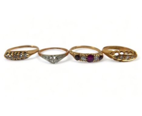 Four various 18ct gold dress rings, comprising a diamond solitaire ring with platinum setting, round cut stone, approximately