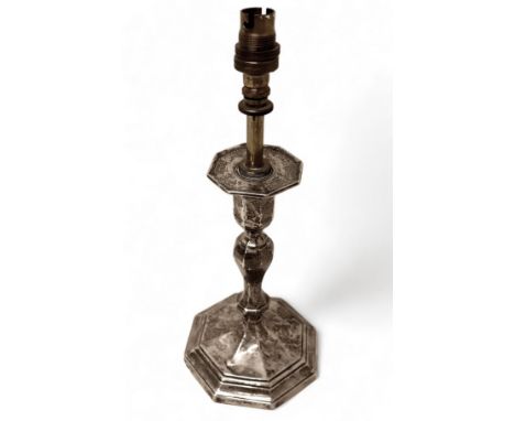 An Edwardian silver candlestick, converted to a table lamp, Hawksworth and Eyers Co. Ltd, Sheffield 1903, the base 10 by 10cm