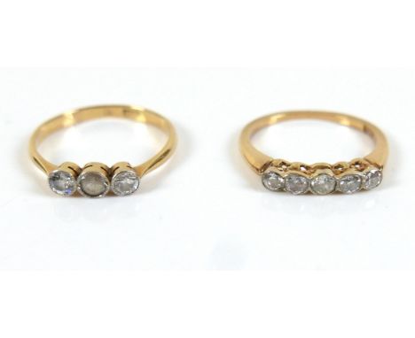 Two 18ct gold and diamond rings, one set with three stones, two diamonds, one clear white stone, each stone approx. 0.1ct, si