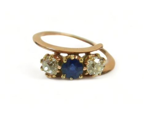 A yellow gold diamond and sapphire three stone ring size M, each stone approximately 0.30ct.Weight 2.7 grams, surface tests t