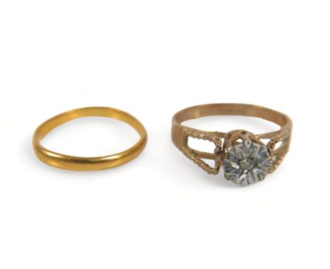 Two dress rings, comprising a yellow metal band, with rubbed markings, size j/k, 1.6g, a/f, together with a 9ct, illusion set