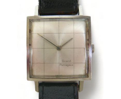 A Girard-Perregaux gentleman stainless steel manual wind wristwatch with a 25mm square dial on a leather strap. In running or