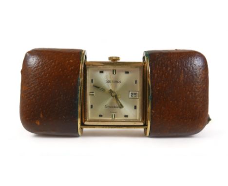 A Majorex convertible manual wind purse/bedside watch in a pull out leather caseWorking order 