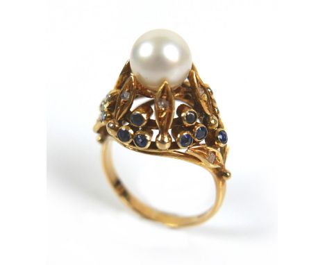 An 18ct yellow gold dress ring, set with centrally with a pearl, 8mm, clasped by six slender leaves each set with a diamond c