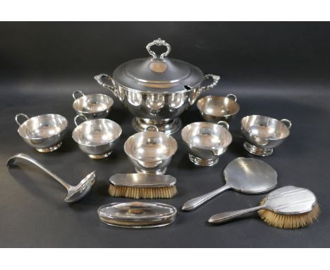 Four George V silver backed dressing table wares, three pieces Walker & Hall, Sheffield 1931, one piece 1933, together with a