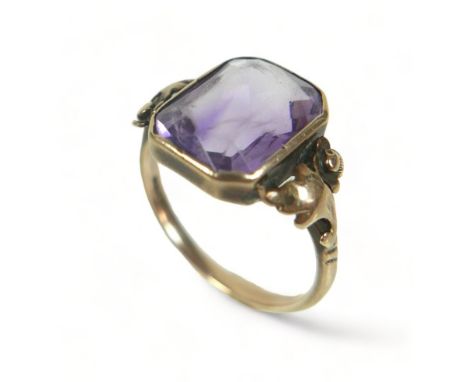 An 8ct 333 yellow gold amethyst ring size N, head size 13mm by 10mm.Some overall wear. 