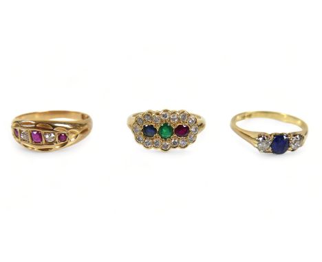 A group of three rings, comprising an 18ct gold five stone, diamond and ruby ring, 2.6g, an 18ct gold three stone ruby ring, 