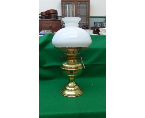 Brass oil lamp with clouded glass shade
