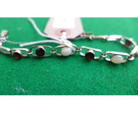 White gold bracelet inset sapphire and opal stones