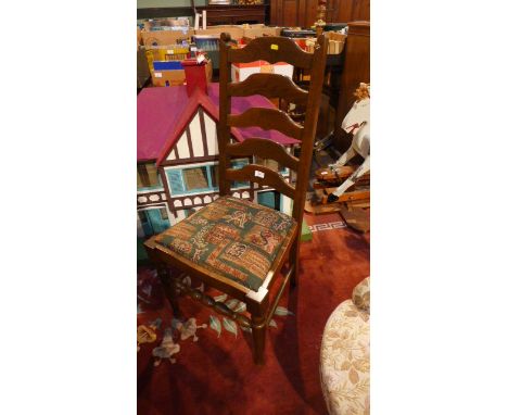 High ladder backed chair and another and a light brown nursing chair