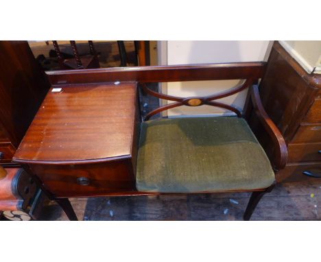 20th century mahogany telephone seat, fitted cupboard and contents, the padded seat upholstered in light green dralon