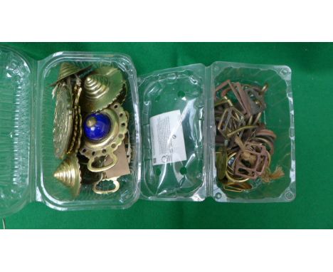 2 plastic boxes of brass and coloured enamel, horse brasses, buckles etc