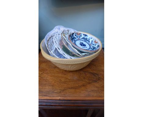Spice rack, mixing bowl with a selection of plates