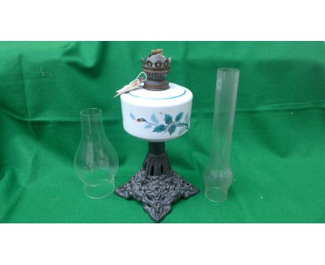 Decorative oil lamp on metal base with hand painted bowl and glass shade sold with a spare flue