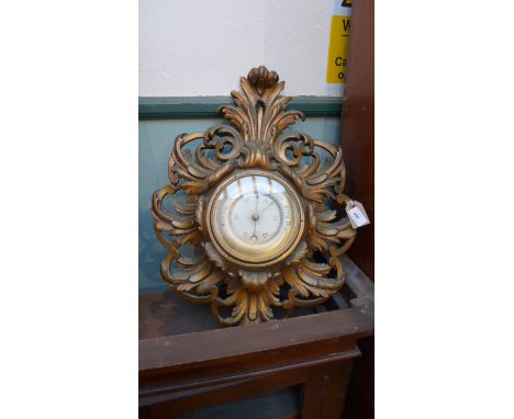 Decorative gilt framed aneroid barometer with brass dial