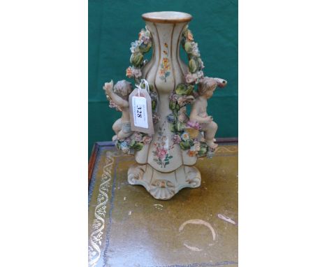 Ornate German mantelpiece vase with raised decoration decorated cherubs