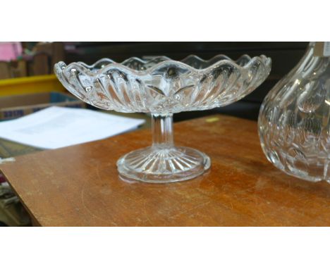 Cut glass circular fruit bowl on plinth and a cut glass port decanter