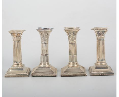 Pair of silver candlesticks, Corinthian columns, stepped and beaded square bases, CB & S Birmingham, 16.5cm, weighted; and a 