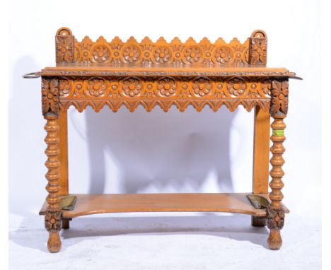 Victorian carved oak hall table, with carved gallery back rectangular top with similar carved frieze, above an undertier acco