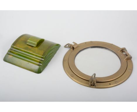 A green bakelite inkwell in the Art Deco style, a brass porthole mirror, two black bakelite extension telephones, a brass Ave
