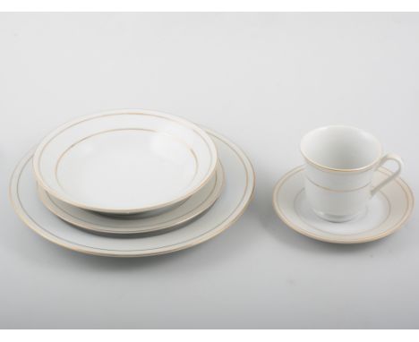 Dinner and tea service, cream with gilt banding, marked Made in China.