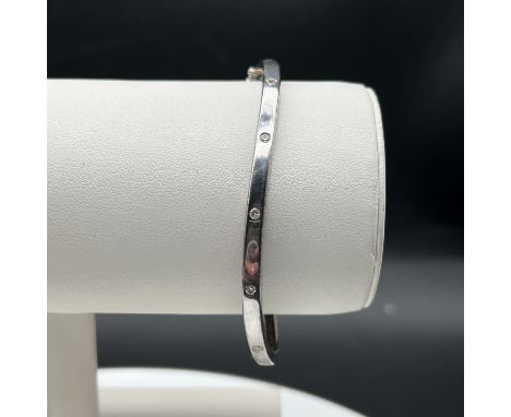 Silver bangle,
stone set in original purchase box,
hallmarked,
14.6 grams