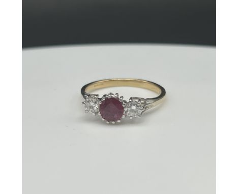 18ct yellow gold ruby and diamond 3 stone ring,
approx 0.40ct diamonds and a 1/2ct ruby,
size Q