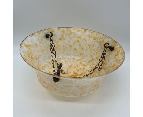 A vintage art deco ceiling light shade,
marled orange in colour with brass chain fittings,
small chips on the lip of the shad