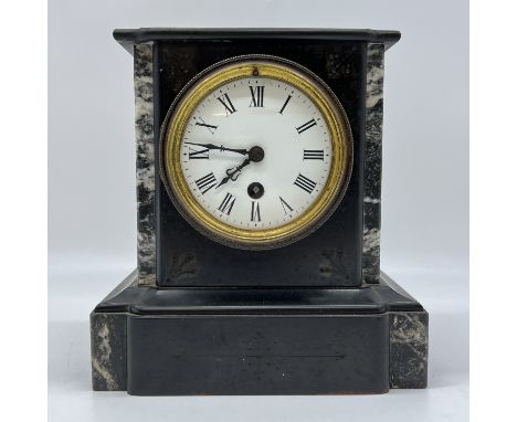 A marble mantel clock,
8 1/2 inches high x 8 inches,
heavy clock,
nice roman numeral dial
&nbsp;