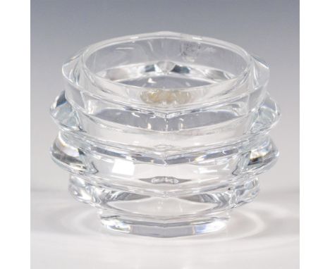 Thick clear crystal, designed in a hollow oval layered shape. Orrefors etched backstamp, and rim stamp. Includes a little can