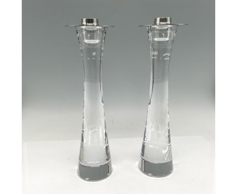Elegant smooth crystal holder with stainless steel ring. Orrefors acid mark. Artist: Ingegerd RamanIssued: 21st centuryDimens