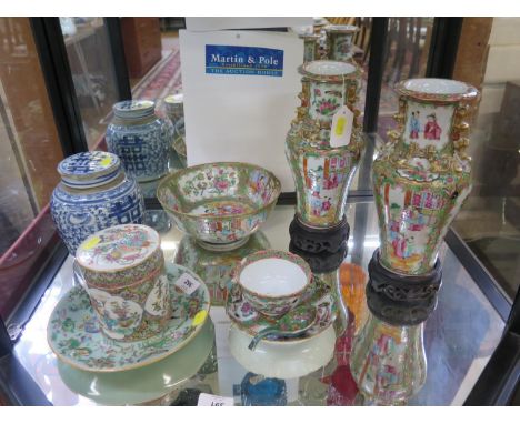 A pair of Chinese famille rose vases, of inverted baluster form and applied with dragons, the  panels depicting figures on a 