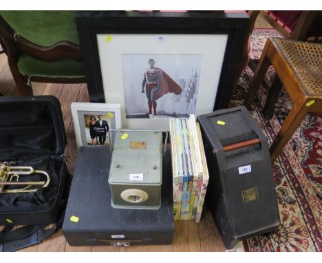 A Leitz Type 'V P' projector, Rupert Bear Annuals, portable typewriter, film promotion postcard for Quantum of Solace and pho