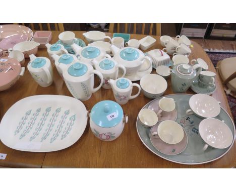 Poole Pottery dinner wares in green and cream, including Leaping Deer pattern, apple design and others 