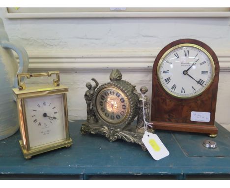 A yew wood veneered quartz table clock by Comitti of London and two other table clocks 