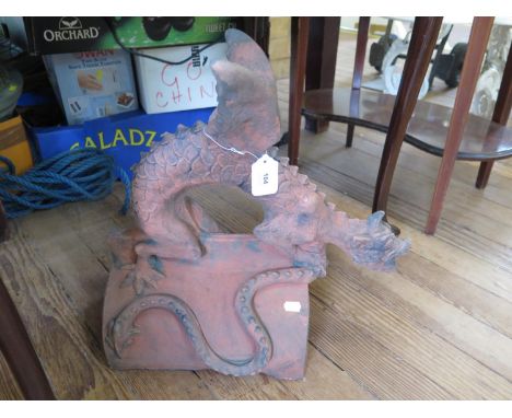 A terracotta ridge tile depicting a Chinese dragon, signed Jameson 2006, 47 cm high 