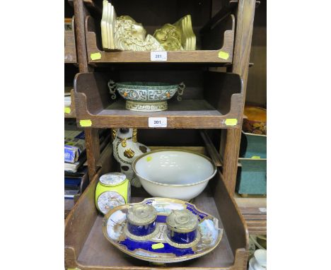 A 19th century Sevres ink standish, the two inkwells on an oval stand with panels of harbour scenes on a dark blue ground, 26