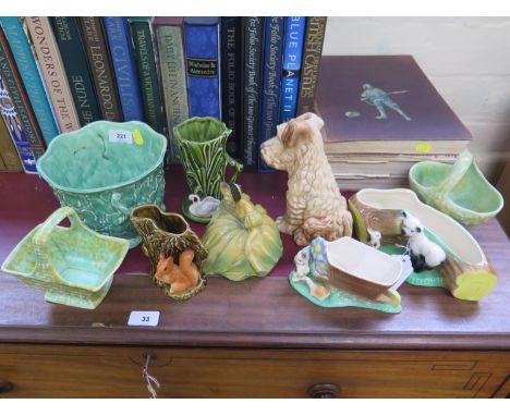 A Sylvac figure of a terrier, 20 cm high, a Wade Figure of a maid 'Curtsey', and other Sylvac, Wade and Hornsea vases 