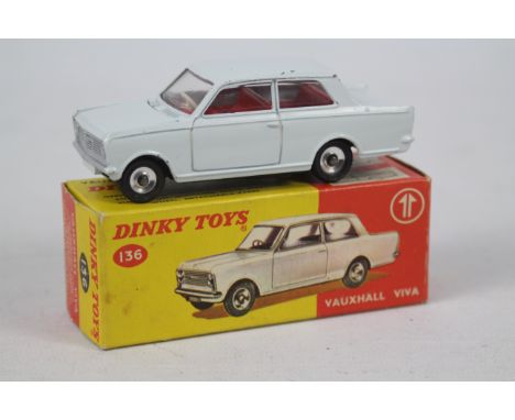 Dinky - A boxed Vauxhall Viva HA saloon in the less common white finish # 136. The car appears in Very Good condition with so