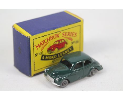 Matchbox - Moko Lesney - A boxed Morris Minor 1000 No.46 in dark green with metal wheels. The car appears in Mint condition i