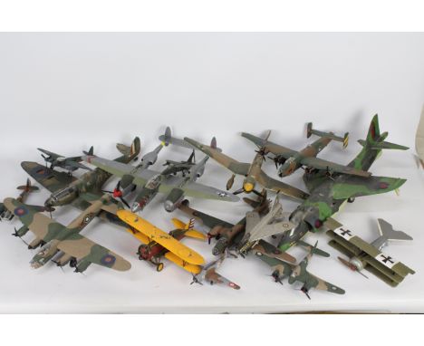 A fleet of constructed and painted plastic model military aircraft kits in a variety of scales. Lot contains, Spitfire, Light