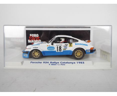 Slotwings - A boxed 1:32 scale Porsche 934 in blue and white Danone livery as driven on the 1983 Catalunya Rallye by Fermin V