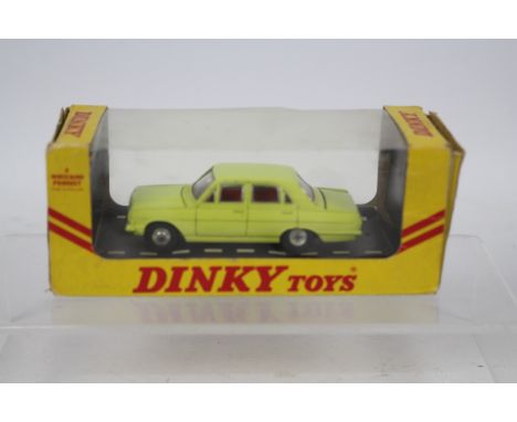 Dinky - A boxed Dinky Vauxhall Victor 101 in the rare yellow finish in the export style window box # 151. The car appears Nea