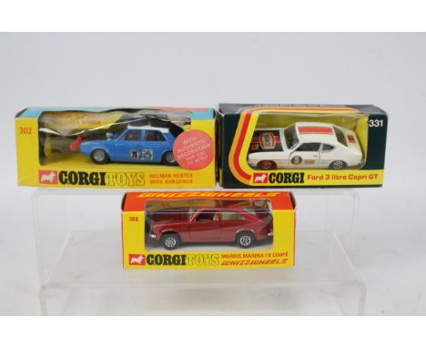 Corgi - 3 x boxed models, Hillman Hunter Rally Car # 302, Morris Marina Coupe # 306, Ford Capri # 331. The cars are Very Good