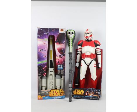Mattel - Hasbro - Star Wars - He-Man - A boxed Star Wars X-Wing Fighter, a boxed Giant Size Clone Shock Trooper which stands 