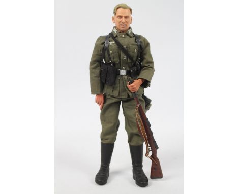 Dragon - An unboxed Dragon WWII German Forces 1:6 scale German Wehrmacht Infantry Soldier. The figure shows signs of display,