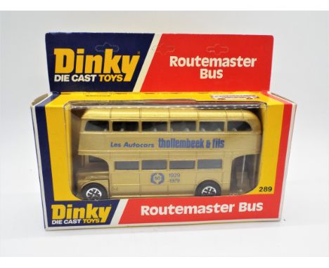 Dinky Toys - A boxed Dinky Toys #289 Routemaster Bus. This promotional bus has gold body, pale blue upper interior, dark blue