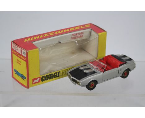 Corgi - A boxed Pontiac Firebird with early Red Spot Whizzwheels # 343. The car appears in Very Good condition with only some
